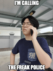 a man wearing glasses is talking on a cell phone with the caption " i 'm calling the freak police " above him