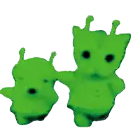 two green stuffed animals with black eyes are standing next to each other