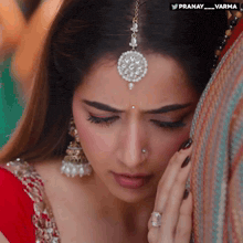 a close up of a woman 's face with the hashtag pranay_varma on the bottom