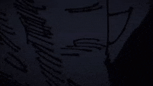 a close up of a person 's face with a drawing on it in the dark .