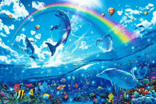 dolphins in the ocean with a rainbow in the background