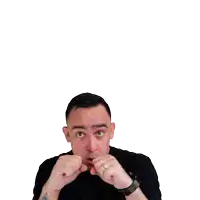 a man 's fist is pointing at the camera and he is wearing a shirt that says ' ufc '