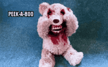 a teddy bear with blood on its face and the words peek-a-boo above it