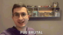 a man wearing glasses and a purple sweatshirt says fue brutal