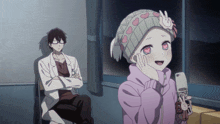 a boy in a lab coat sits next to a girl in a pink jacket