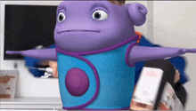 a purple and blue cartoon character with a swirl on its chest