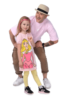 a man and a little girl are posing for a picture and the little girl is wearing a princess shirt