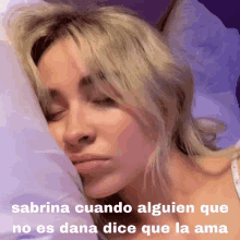 a picture of a woman sleeping with the caption sabrina cuando alguien que no es dana dice que la ama