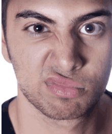 a close up of a man 's face with his mouth open