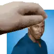 a hand is holding a picture of a man 's face .