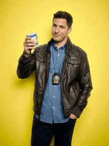 a man wearing a leather jacket and a badge that says nypd