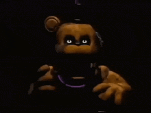 a close up of a teddy bear in a dark room with glowing eyes .