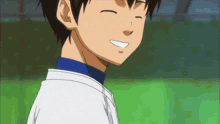 a young boy with his eyes closed is smiling