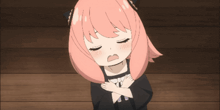a girl with pink hair is making a sad face with her eyes closed