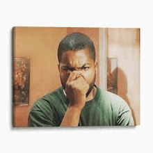 a man is covering his nose with his hand while looking at himself in a mirror .