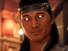 a man wearing a headband has glowing eyes