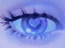 a close up of a blue eye on a purple background