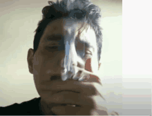 a man with smoke coming out of his nose