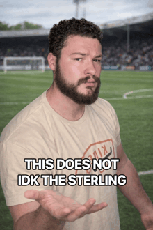 a man with a beard is wearing a t-shirt that says this does not idk the sterling