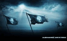 three alienware flags are waving in the wind .