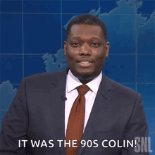a man in a suit and tie says it was the 90s colin snl