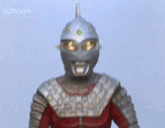a cartoon character with the word ultraman on the bottom left