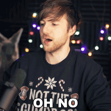 a man wearing a black sweater that says not the oh no