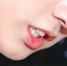 a close up of a person 's mouth with their teeth visible .