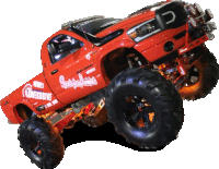 a red monster truck with the word lowerdrive on it