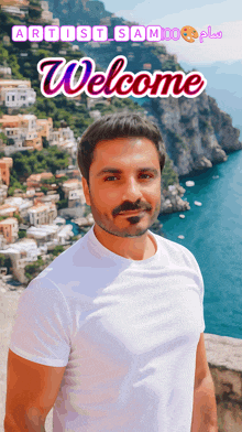 a man in a white shirt is standing in front of a cliff overlooking the ocean with the words welcome above him