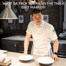 a chef in a kitchen with a caption that says what da fuck you mean the table isn t marked