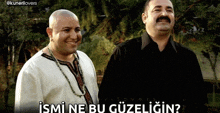 two men standing next to each other with a caption that says " ismi ne bu güzeligin "