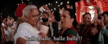 a group of people are dancing at a party and one of them says balle balle balle balle