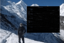 a blurry picture of a man standing on a snowy mountain