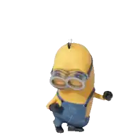 a yellow minion wearing goggles and overalls is waving