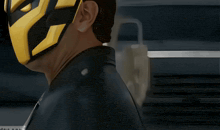 a man wearing a yellow mask and a leather jacket