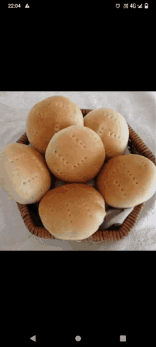 a bunch of bread in a basket with the time of 22:44