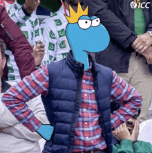 a man wearing a plaid shirt and a blue vest has a cartoon character with a crown on his head behind him