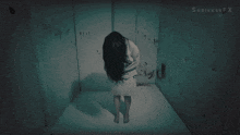 a woman in a straitjacket is standing in a dark room with shrinkfx written on the bottom right