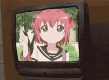 a girl with pink hair is giving a peace sign on a tv screen