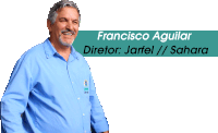 a man in a blue shirt stands in front of a banner that says francisco aguilar