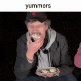 a man wearing a chicago bulls hat is eating some food