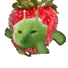 a strawberry with a green alien face on it