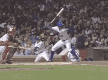 a baseball player is swinging his bat at a ball in front of a sign that says walter e. smith