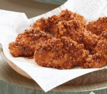 a plate of fried chicken nuggets on a piece of paper that says coke