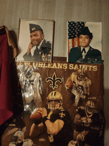 a poster for the new orleans saints football team hangs on the wall