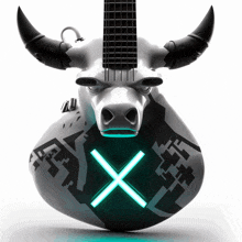 a statue of a bull with a guitar on its head and an x on it