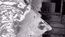 a black and white drawing of a woman 's face in the water