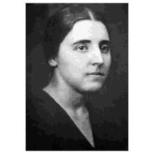 a black and white photo of a woman with long hair .