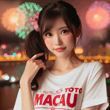 a woman wearing a white toto macau shirt